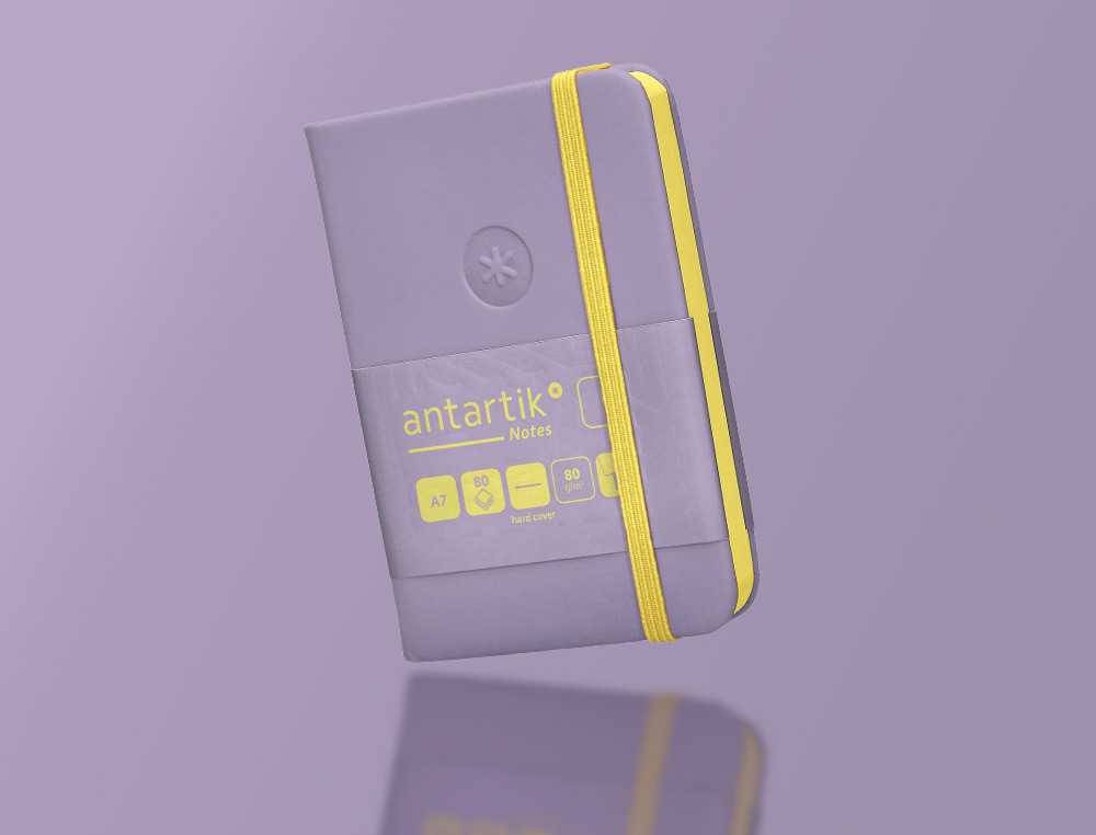 CARNET FERMETURE ELASTIQUE JAUNE ANTARTIK NOTES COUVERTURE RIGIDE A7 PAPIER UNI IVOIRE 80 FEUILLES 80GR FSC LILAS